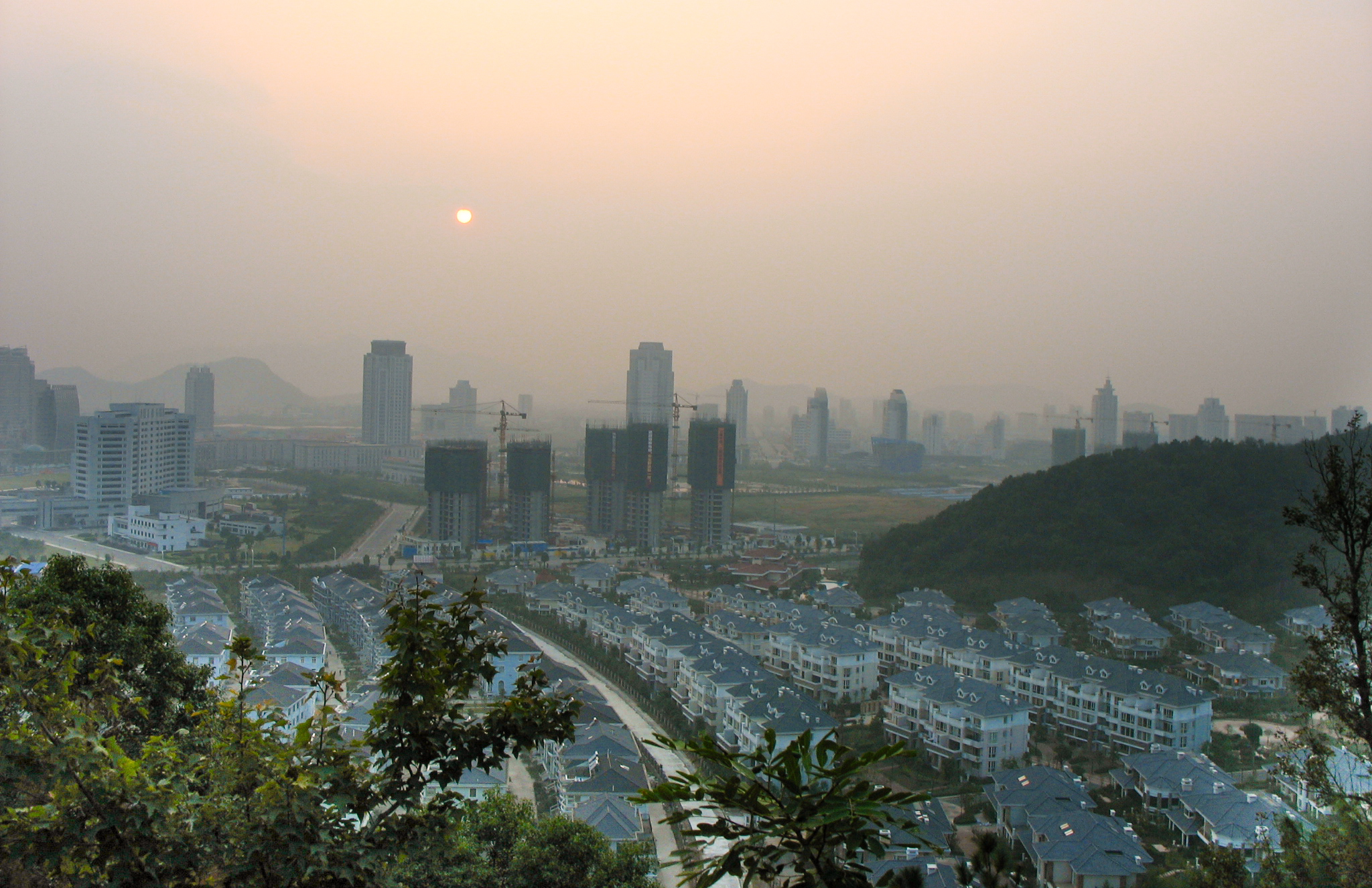 An aerial view of apartment buildings with high-rises in the background in Taizhou, China